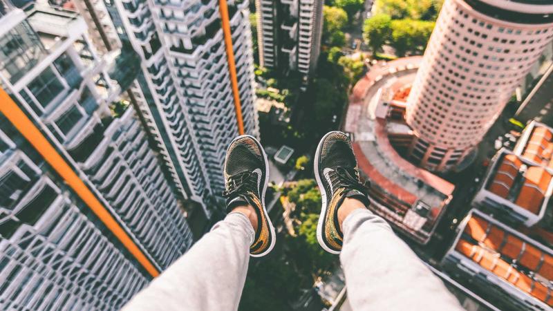 A split image showing the 'Deadbug' exercise on the left and 'Bird-dog' exercise on the right, demonstrated clearly on a yoga mat with alignment lines.
